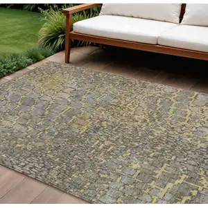 Photo of Gold And Gray Abstract Washable Indoor Outdoor Area Rug