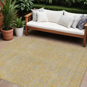 Photo of Gold And Gray Abstract Washable Indoor Outdoor Area Rug
