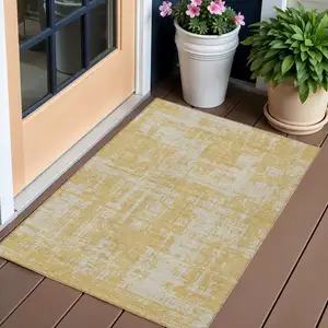 Photo of Gold And Gray Abstract Washable Indoor Outdoor Area Rug