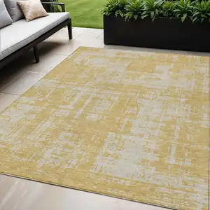 Photo of Gold And Gray Abstract Washable Indoor Outdoor Area Rug