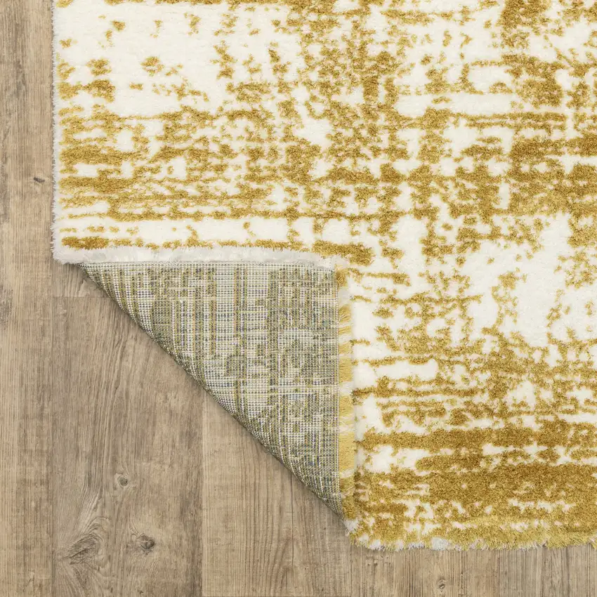 Gold And Ivory Abstract Area Rug Photo 9