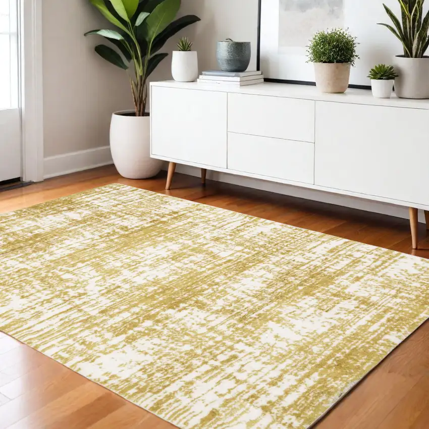 Gold And Ivory Abstract Area Rug Photo 1