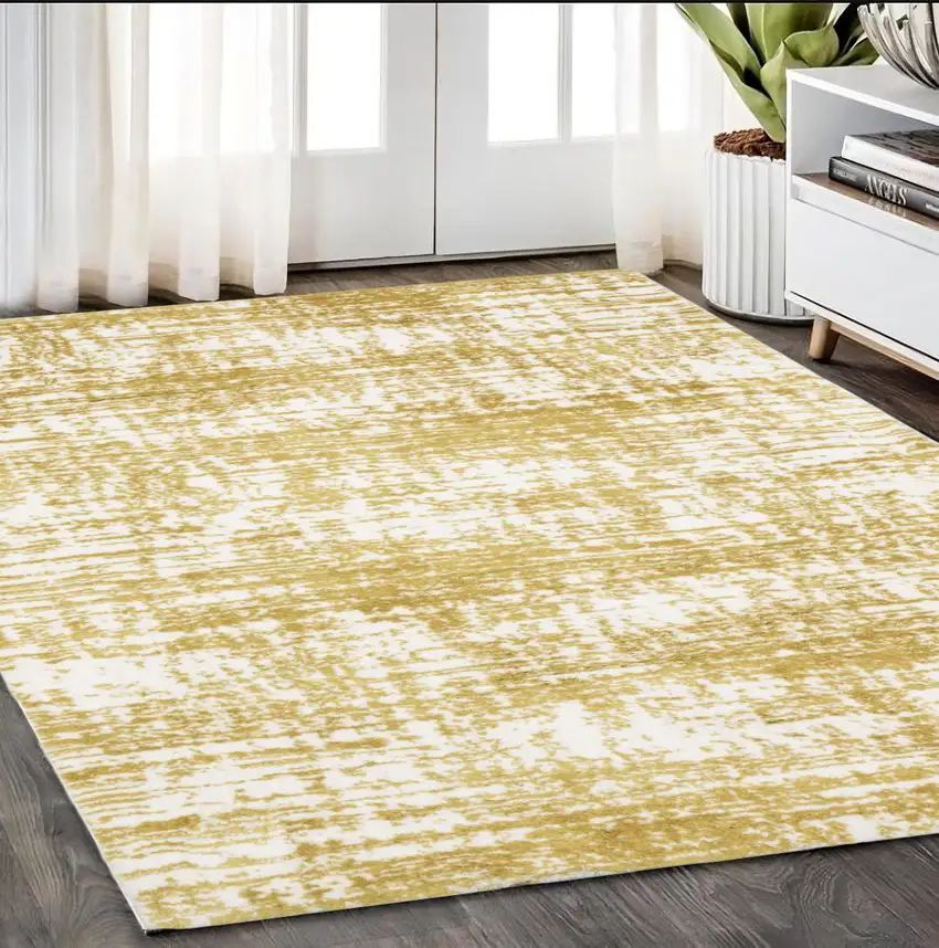 Gold And Ivory Abstract Area Rug Photo 1