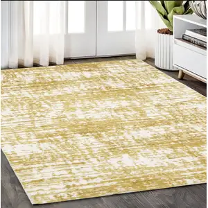 Photo of Gold And Ivory Abstract Area Rug