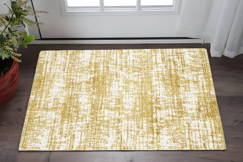 Gold And Ivory Abstract Area Rug Photo 1