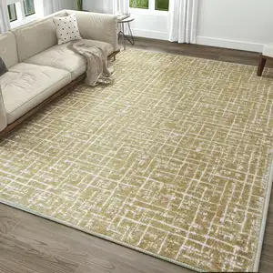 Photo of Gold And Ivory Abstract Geometric Distressed Washable Area Rug