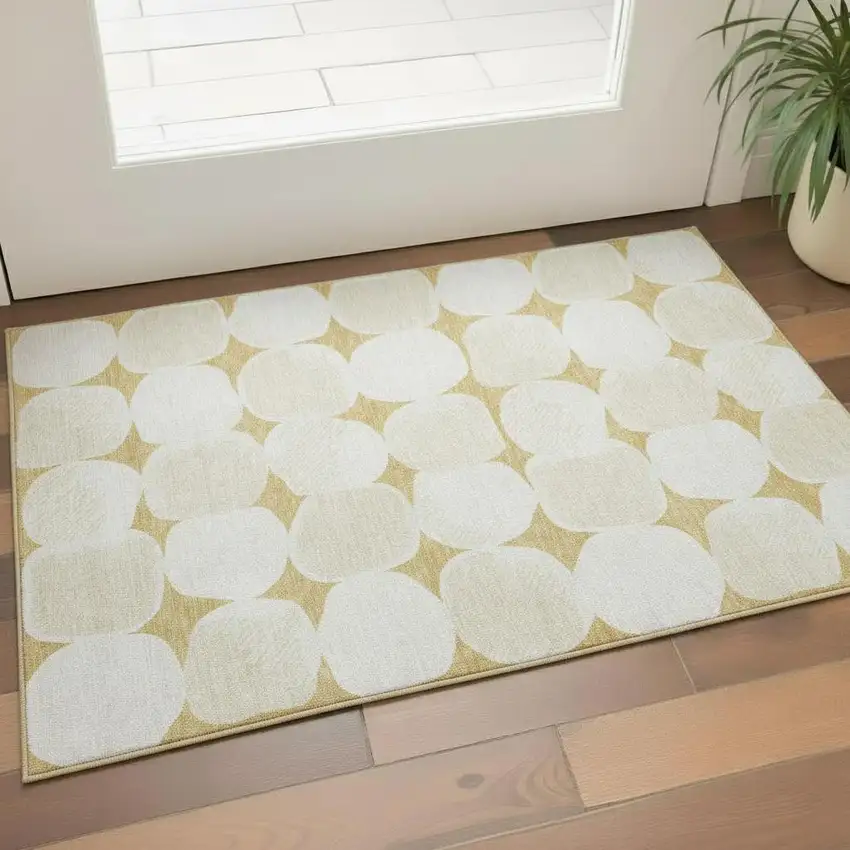 Gold And Ivory Abstract Geometric Washable Area Rug With UV Protection Photo 1