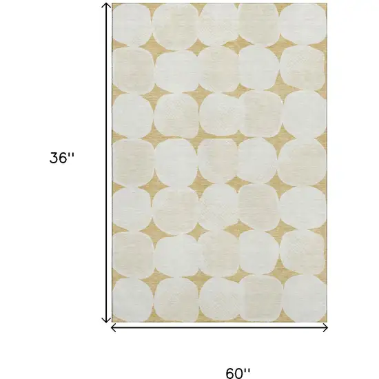 Gold And Ivory Abstract Geometric Washable Area Rug With UV Protection Photo 3