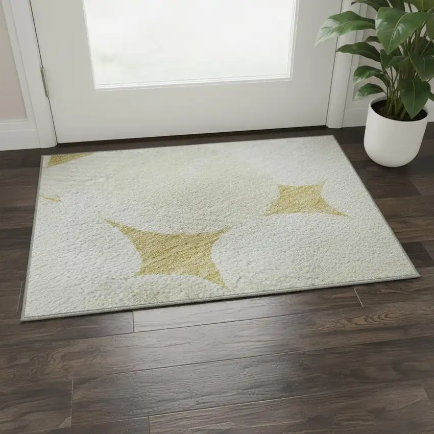 Gold And Ivory Abstract Geometric Washable Area Rug With UV Protection Photo 2