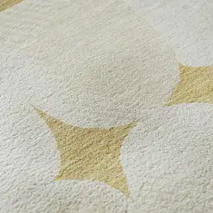 Photo of Gold And Ivory Abstract Geometric Washable Area Rug With UV Protection