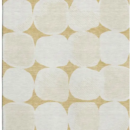 Gold And Ivory Abstract Geometric Washable Area Rug With UV Protection Photo 9