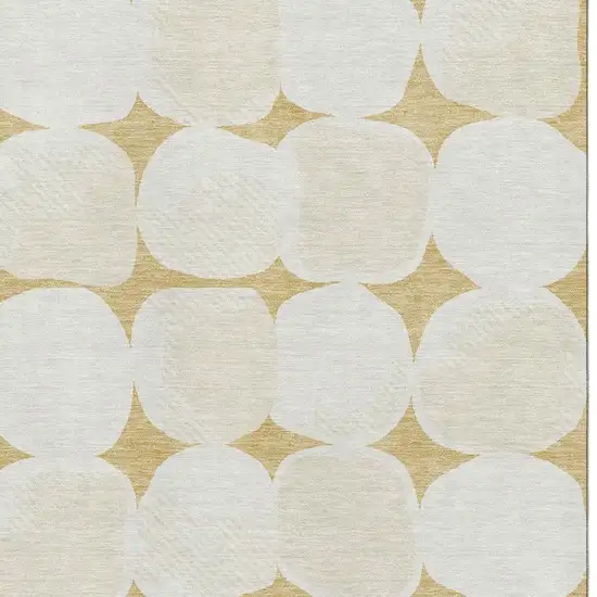 Gold And Ivory Abstract Geometric Washable Area Rug With UV Protection Photo 3