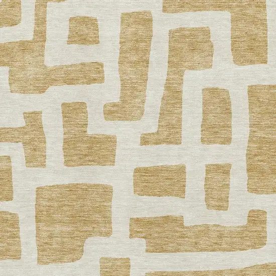 Gold And Ivory Abstract Geometric Washable Area Rug With UV Protection Photo 3