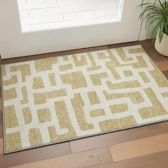 Gold And Ivory Abstract Geometric Washable Area Rug With UV Protection Photo 2