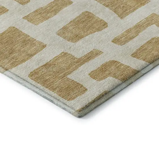 Gold And Ivory Abstract Geometric Washable Area Rug With UV Protection Photo 8