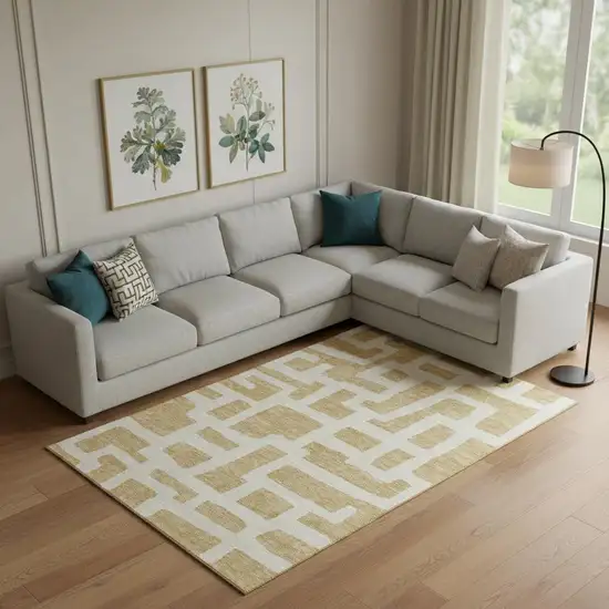Gold And Ivory Abstract Geometric Washable Area Rug With UV Protection Photo 1