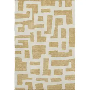 Photo of Gold And Ivory Abstract Geometric Washable Area Rug With UV Protection