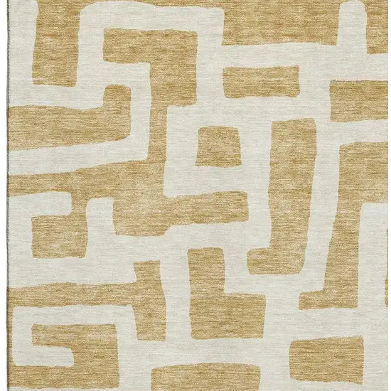 Gold And Ivory Abstract Geometric Washable Area Rug With UV Protection Photo 3