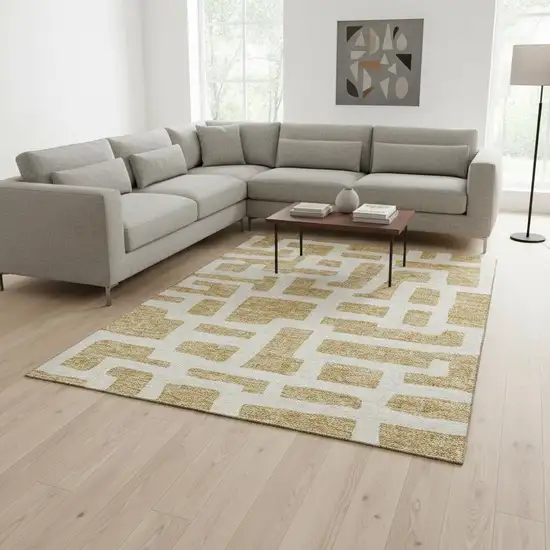 Gold And Ivory Abstract Geometric Washable Area Rug With UV Protection Photo 2