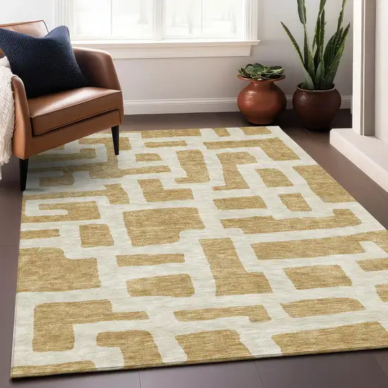 Gold And Ivory Abstract Geometric Washable Area Rug With UV Protection Photo 5