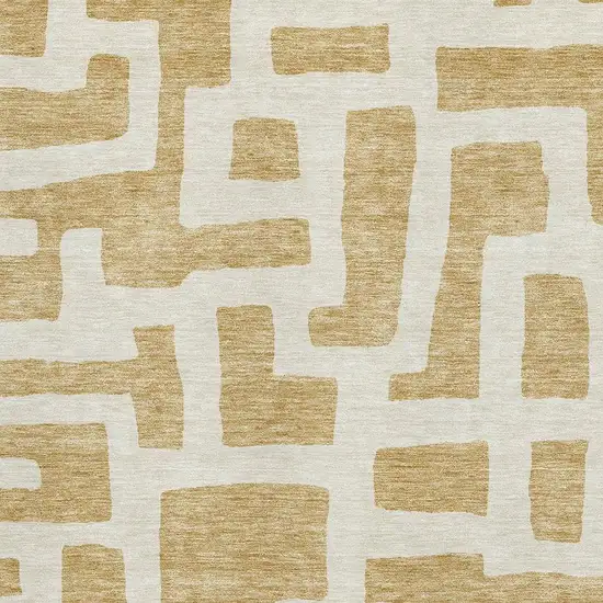 Gold And Ivory Abstract Geometric Washable Area Rug With UV Protection Photo 3