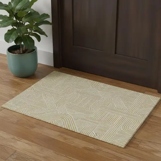 Gold And Ivory Abstract Geometric Washable Area Rug With UV Protection Photo 1