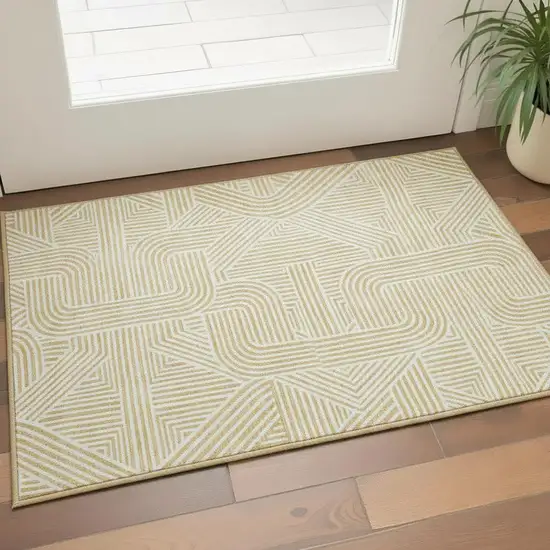 Gold And Ivory Abstract Geometric Washable Area Rug With UV Protection Photo 2