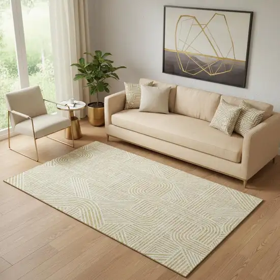 Gold And Ivory Abstract Geometric Washable Area Rug With UV Protection Photo 1