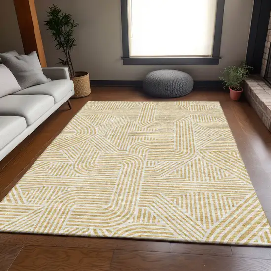 Gold And Ivory Abstract Geometric Washable Area Rug With UV Protection Photo 6