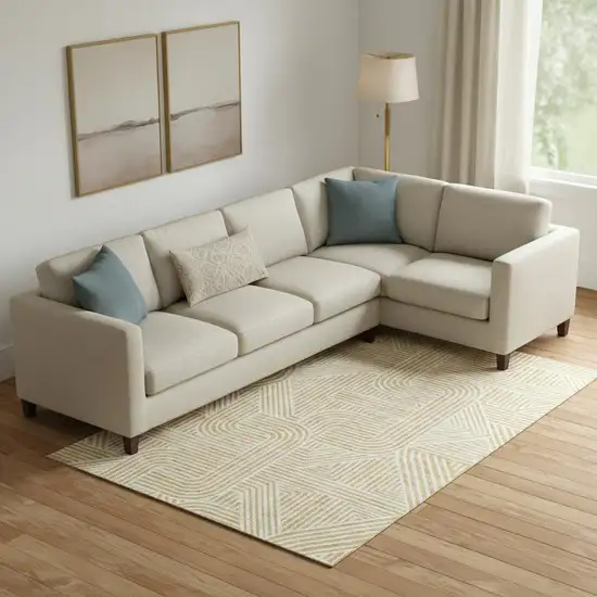 Gold And Ivory Abstract Geometric Washable Area Rug With UV Protection Photo 1