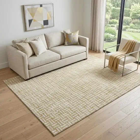Gold And Ivory Abstract Geometric Washable Area Rug With UV Protection Photo 1