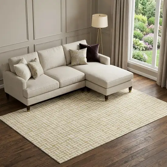 Gold And Ivory Abstract Geometric Washable Area Rug With UV Protection Photo 1