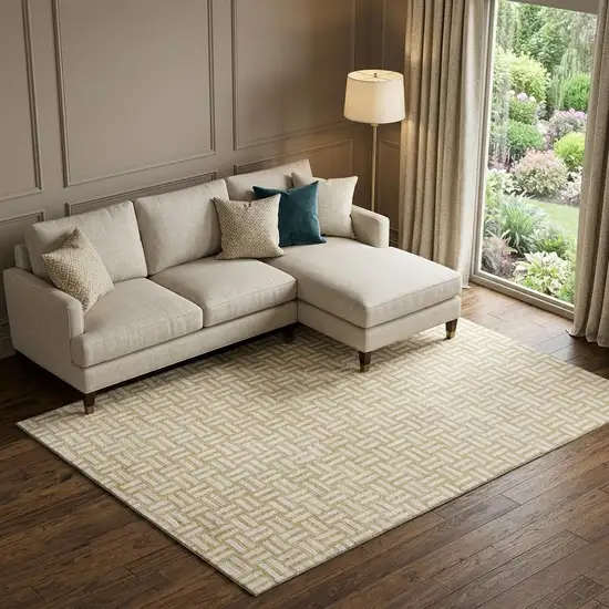 Gold And Ivory Abstract Geometric Washable Area Rug With UV Protection Photo 1