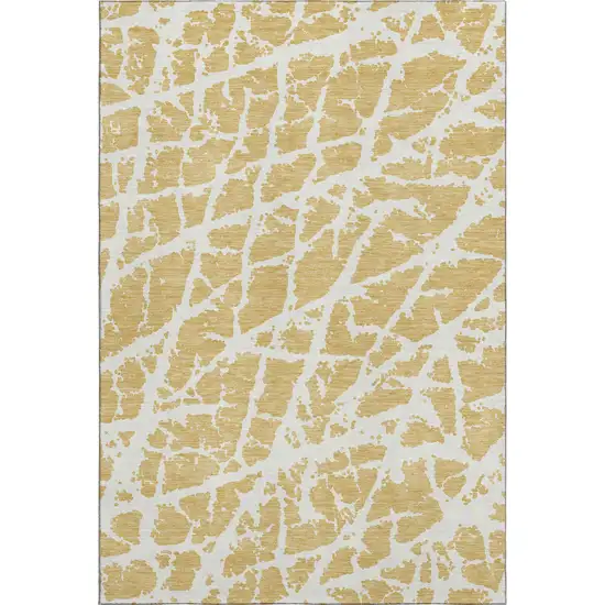 Gold And Ivory Abstract Washable Area Rug With UV Protection Photo 1