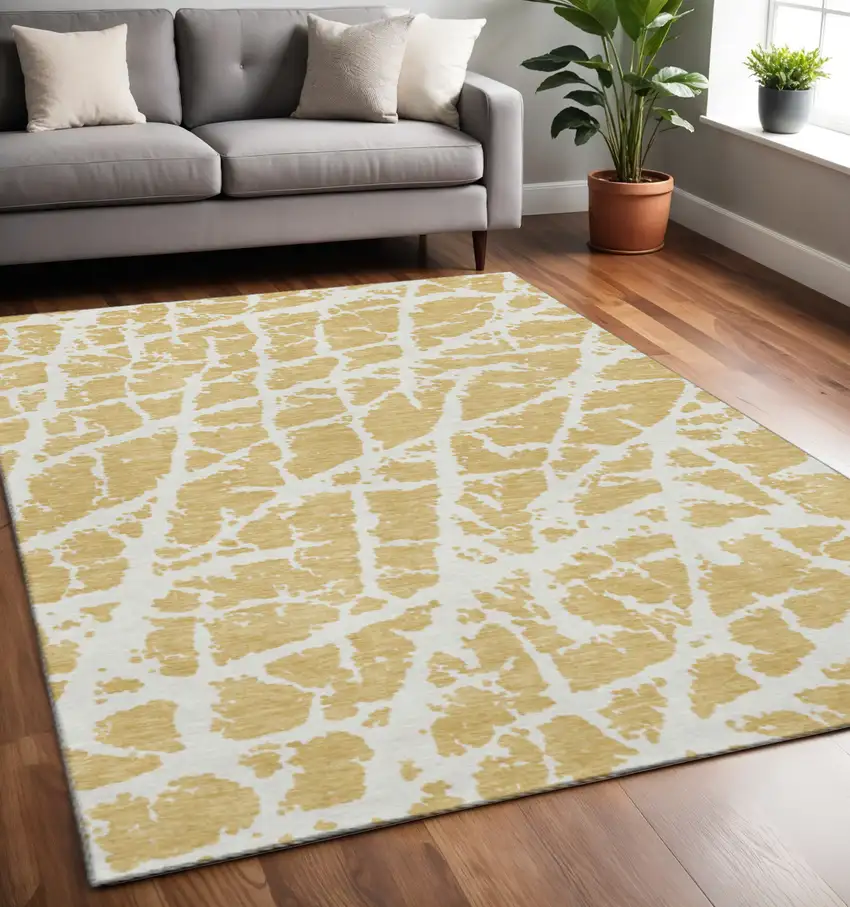 Gold And Ivory Abstract Washable Area Rug With UV Protection Photo 2