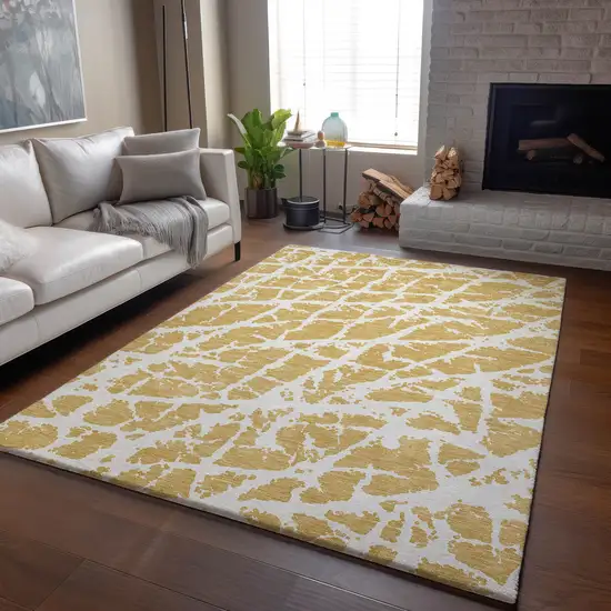 Gold And Ivory Abstract Washable Area Rug With UV Protection Photo 6