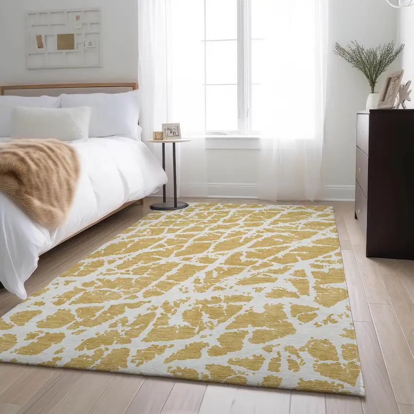 Gold And Ivory Abstract Washable Area Rug With UV Protection Photo 5