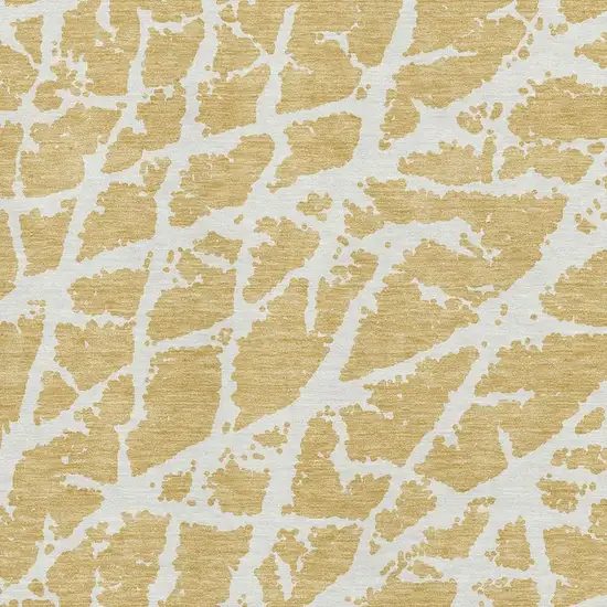 Gold And Ivory Abstract Washable Area Rug With UV Protection Photo 3