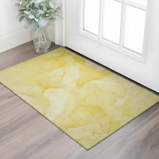 Gold And Ivory Abstract Washable Area Rug With UV Protection Photo 1