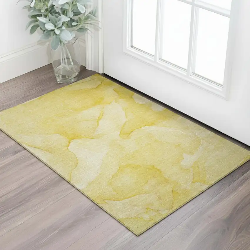 Gold And Ivory Abstract Washable Area Rug With UV Protection Photo 1
