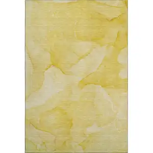 Photo of Gold And Ivory Abstract Washable Area Rug With UV Protection