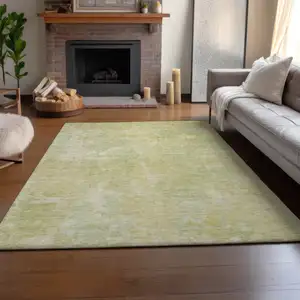 Photo of Gold And Ivory Abstract Washable Area Rug With UV Protection