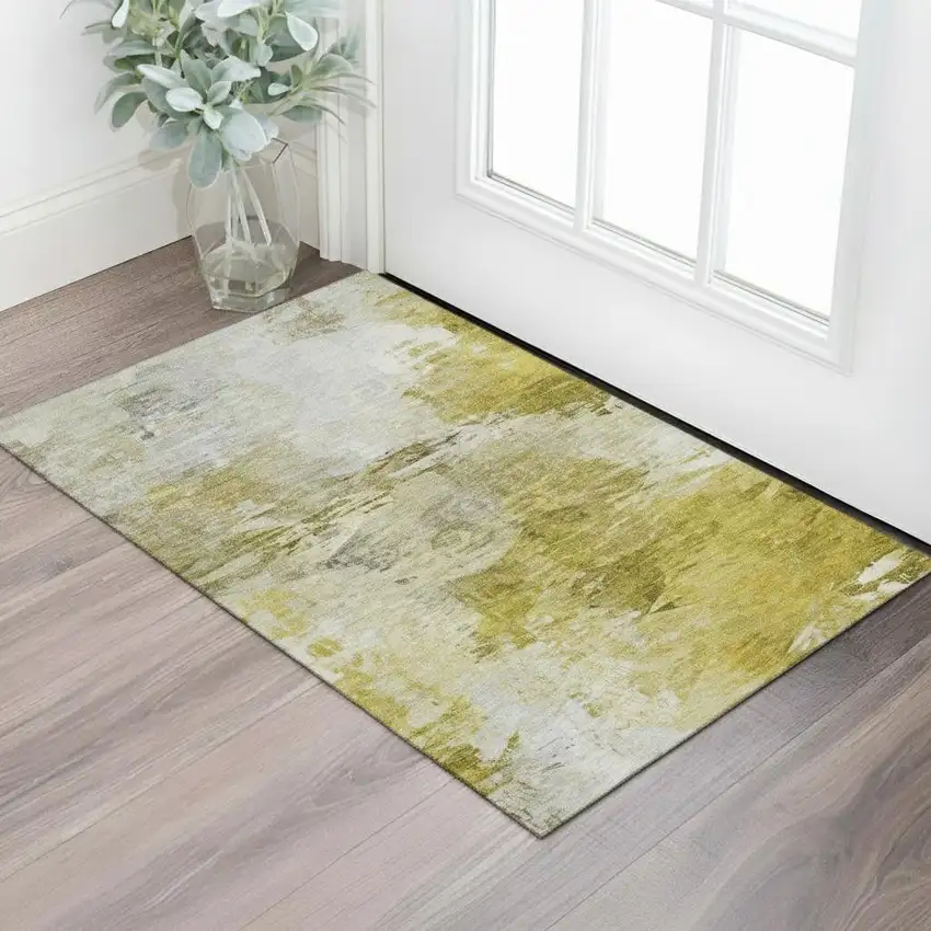 Gold And Ivory Abstract Washable Area Rug With UV Protection Photo 1
