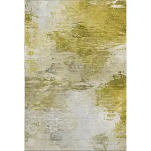 Photo of Gold And Ivory Abstract Washable Area Rug With UV Protection
