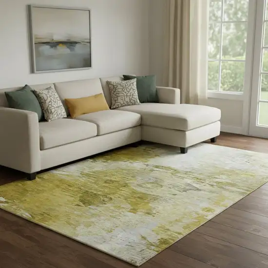 Gold And Ivory Abstract Washable Area Rug With UV Protection Photo 1