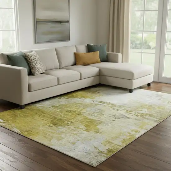 Gold And Ivory Abstract Washable Area Rug With UV Protection Photo 1