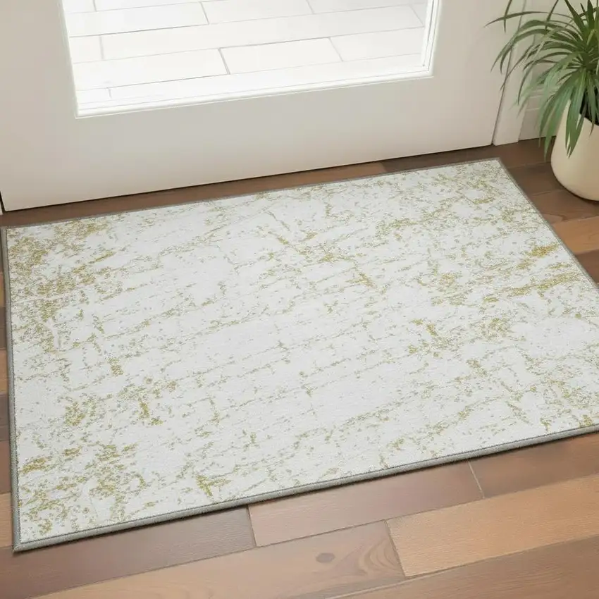 Gold And Ivory Abstract Washable Area Rug With UV Protection Photo 2