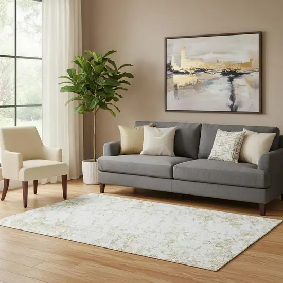Gold And Ivory Abstract Washable Area Rug With UV Protection Photo 1