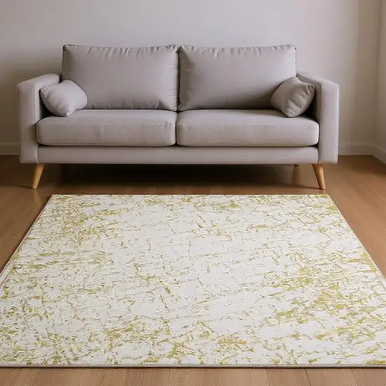 Gold And Ivory Abstract Washable Area Rug With UV Protection Photo 2