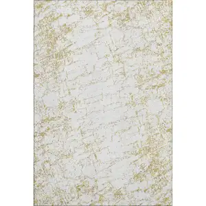 Photo of Gold And Ivory Abstract Washable Area Rug With UV Protection